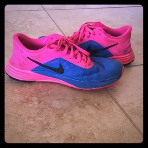 Hot pink and blue nike shoes